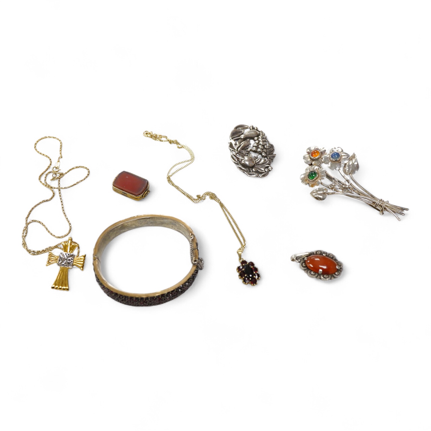 An 800 standard gilt white metal and garnet cluster set oval pendant, 18mm, on a 585 yellow metal fine link chain, 2.5 grams, a gilt white metal and garnet cluster set hinged bangle, two white metal brooches including on